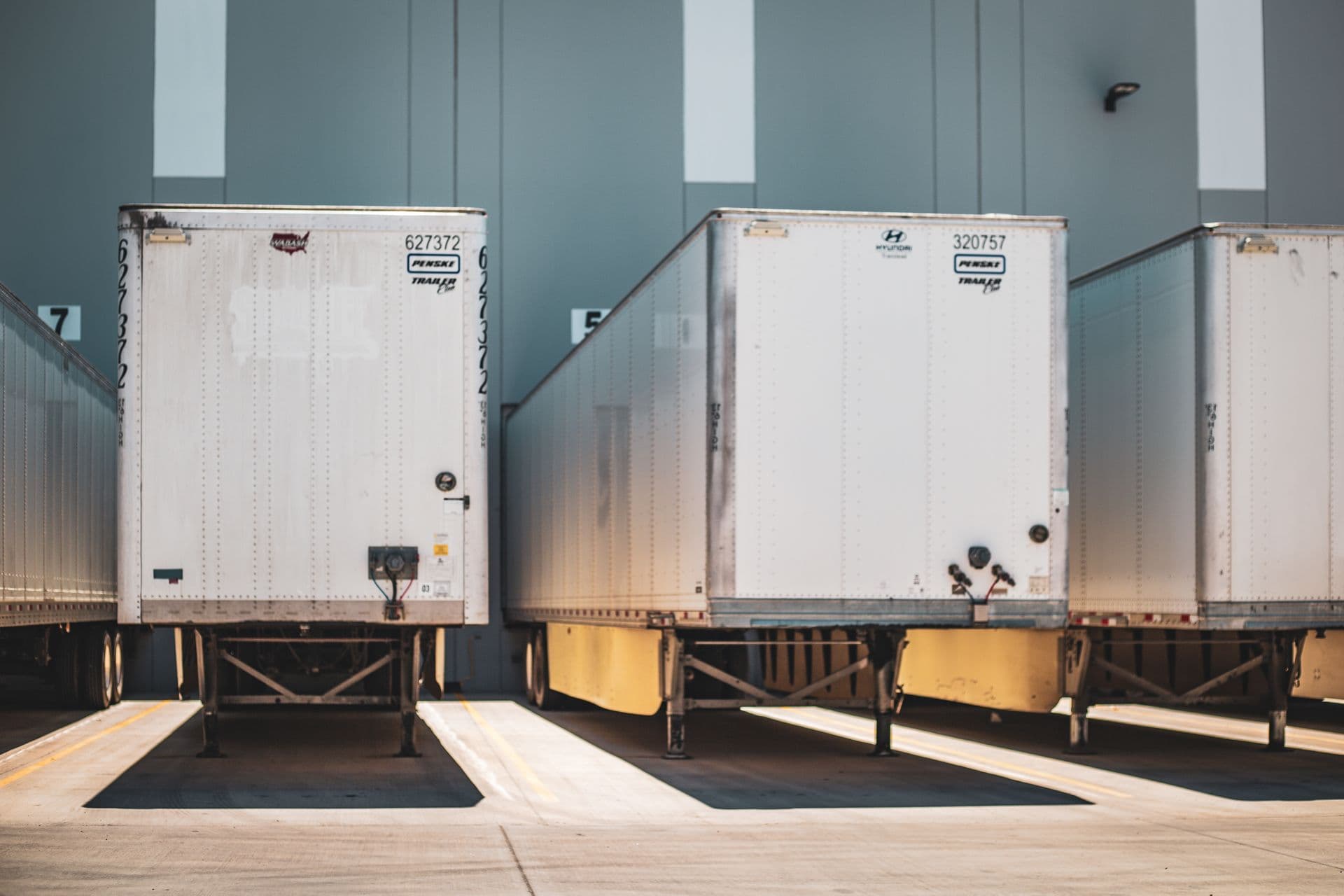 Refrigerated trailers parked at a commercial loading dock